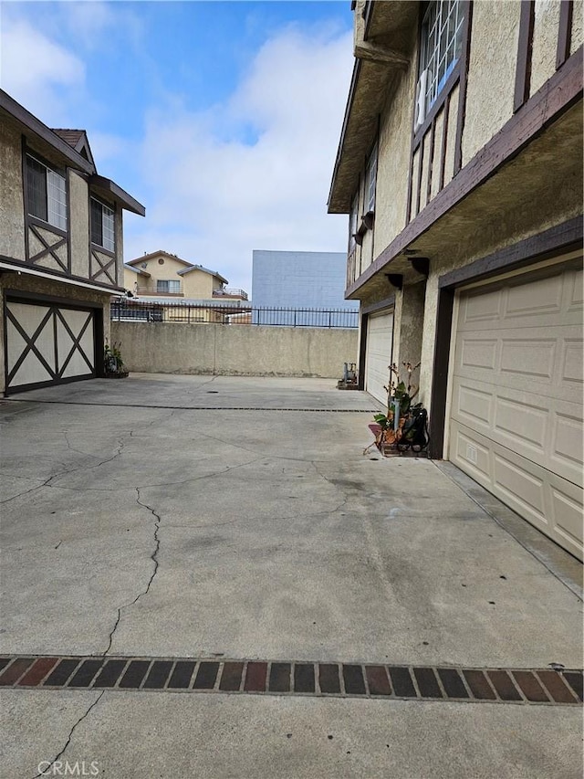 exterior space featuring a water view and a garage