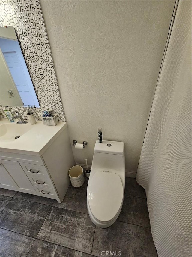 bathroom with vanity and toilet