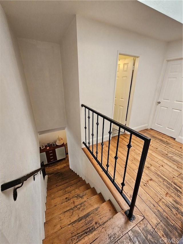 stairway featuring hardwood / wood-style flooring