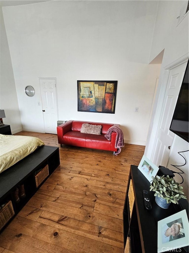 bedroom with hardwood / wood-style floors