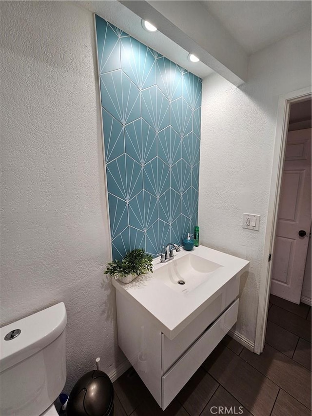 bathroom with vanity and toilet