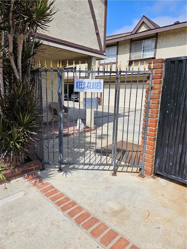 view of gate with fence