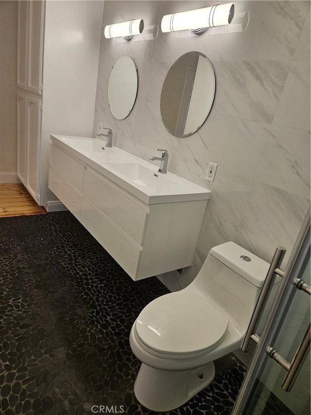 13921 Kornblum Unit 9, Hawthorne, CA 90250 - bathroom featuring a sink, toilet, and double vanity