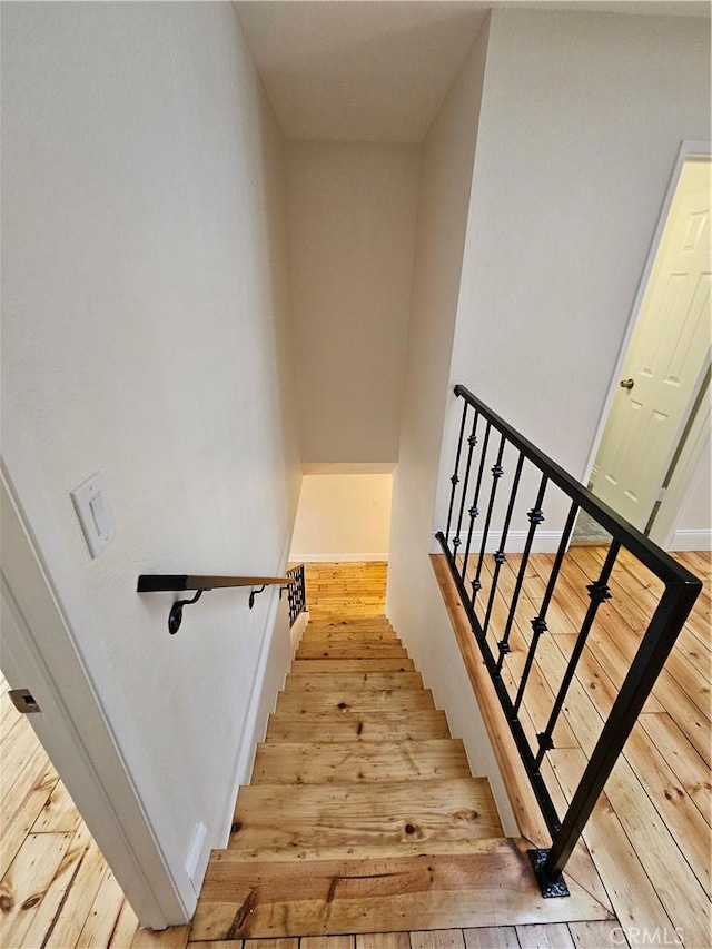 13921 Kornblum Unit 9, Hawthorne, CA 90250 - stairway with hardwood / wood-style flooring and baseboards