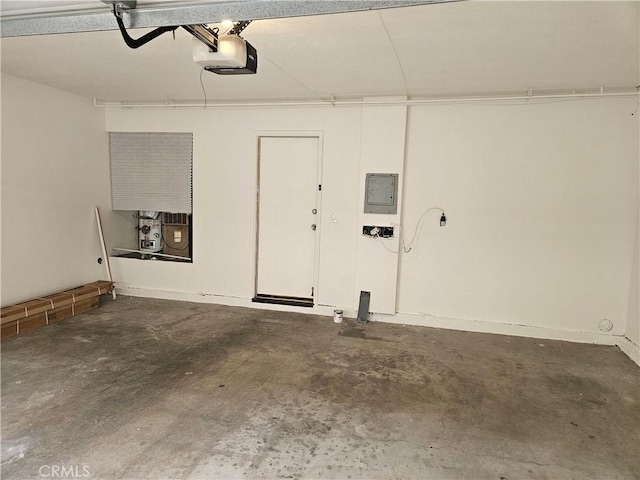 13921 Kornblum Unit 9, Hawthorne, CA 90250 - garage featuring a garage door opener and electric panel