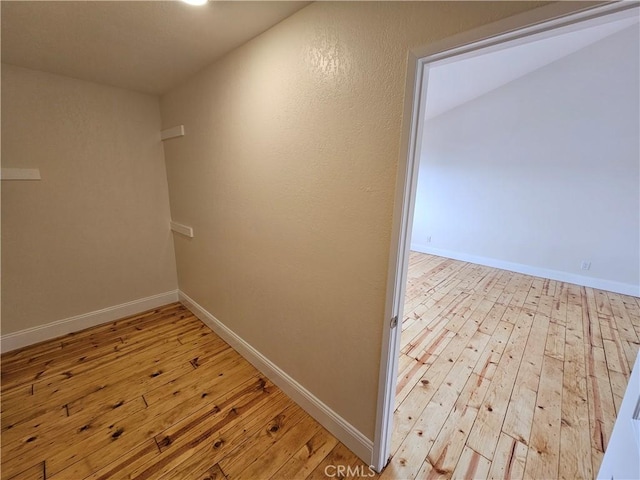 interior space with light wood-style flooring and baseboards