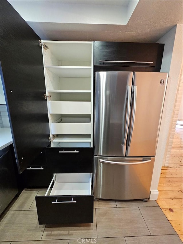 kitchen featuring freestanding refrigerator