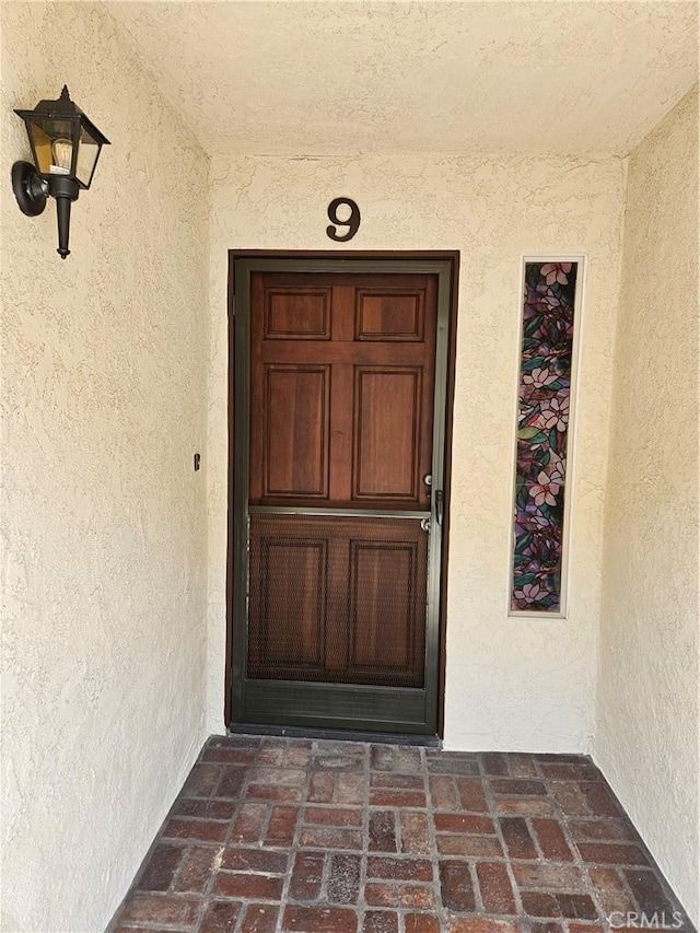 13921 Kornblum Unit 9, Hawthorne, CA 90250 - doorway to property featuring stucco siding