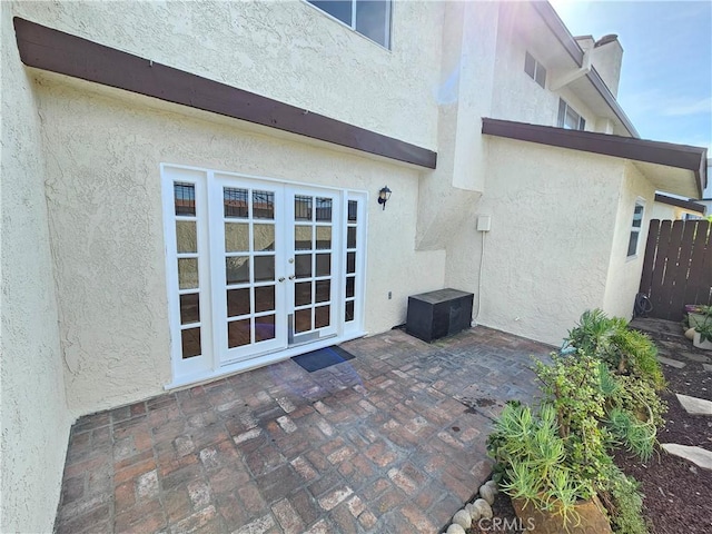 13921 Kornblum Unit 9, Hawthorne, CA 90250 - rear view of house featuring a patio area, french doors, fence, and stucco siding