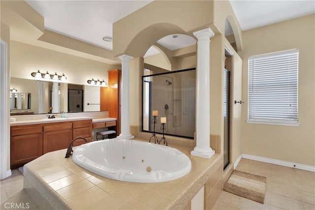 bathroom with decorative columns, shower with separate bathtub, and tile patterned flooring