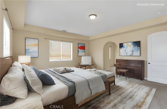 bedroom with light hardwood / wood-style floors