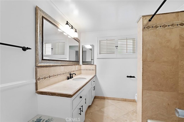 bathroom featuring decorative backsplash, vanity, crown molding, a shower, and toilet