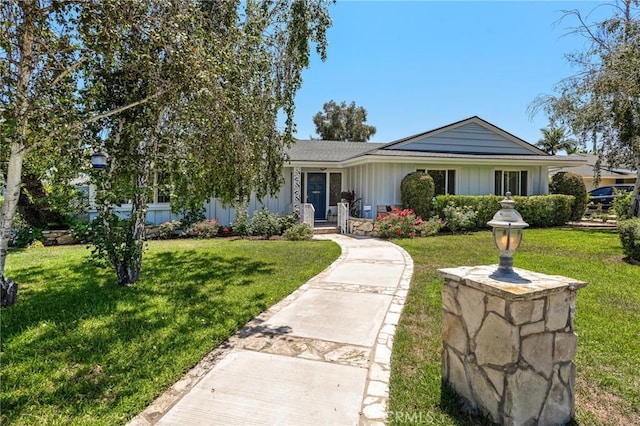 single story home featuring a front yard