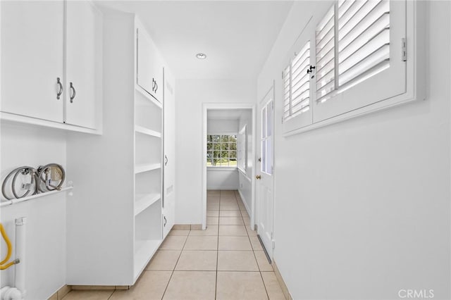 hallway featuring light tile patterned floors