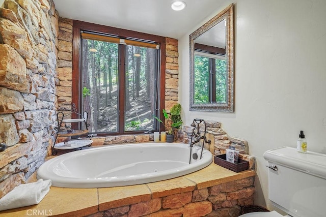 29130 Bald Eagle Rdg, Lake Arrowhead, CA 92352 - bathroom featuring plenty of natural light, a relaxing tiled tub, and toilet
