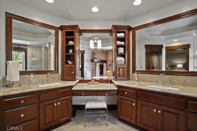 29130 Bald Eagle Rdg, Lake Arrowhead, CA 92352 - bathroom featuring a stone fireplace and vanity