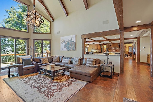 29130 Bald Eagle Rdg, Lake Arrowhead, CA 92352 - living room featuring wood-type flooring, a wealth of natural light, and a chandelier