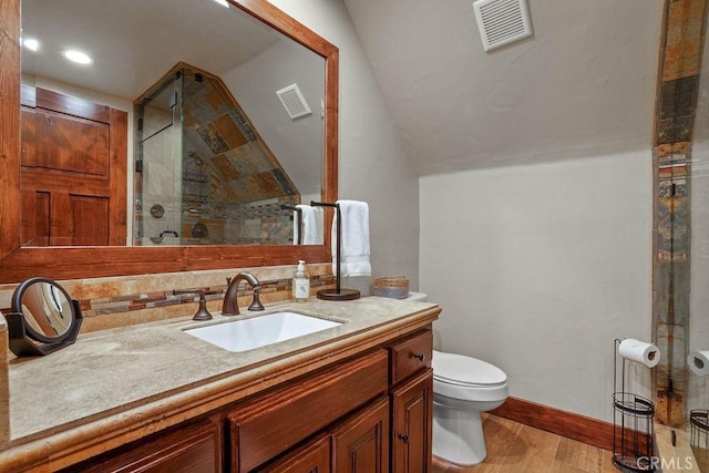 29130 Bald Eagle Rdg, Lake Arrowhead, CA 92352 - bathroom with toilet, vanity, a shower with shower door, and hardwood / wood-style flooring