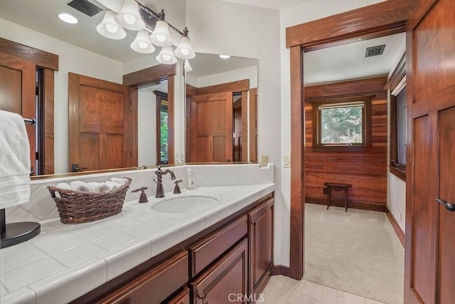 29130 Bald Eagle Rdg, Lake Arrowhead, CA 92352 - bathroom featuring vanity, backsplash, and wood walls