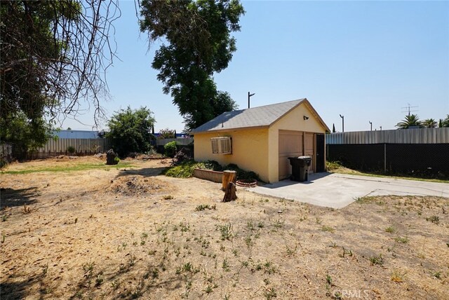 view of home's exterior with an outdoor structure