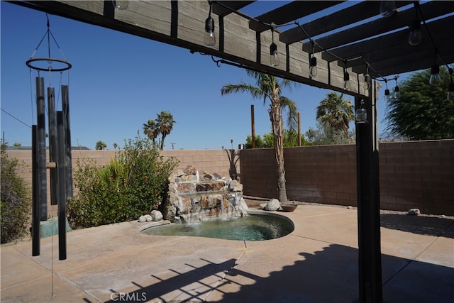 view of patio / terrace with a fenced backyard and a pergola