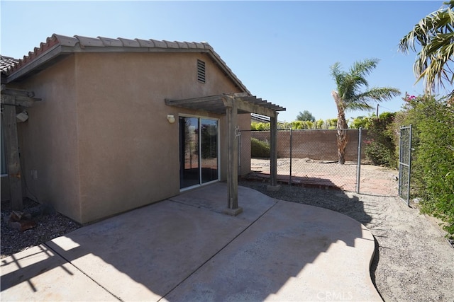 view of patio featuring fence and a pergola