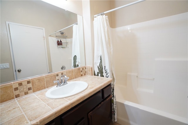 full bathroom featuring backsplash, vanity, and shower / tub combo with curtain