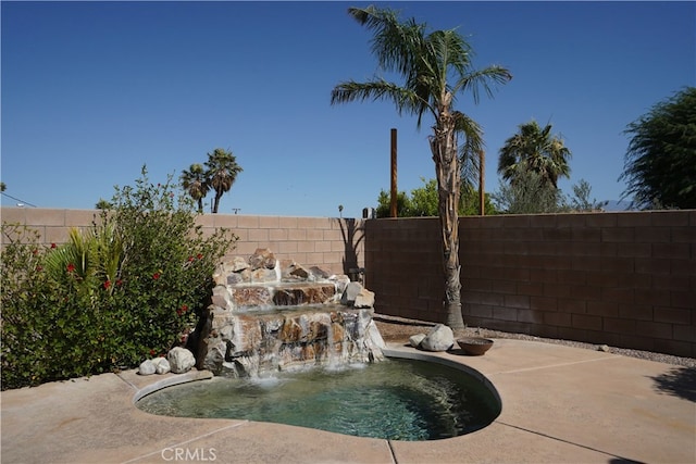 view of pool featuring a fenced backyard