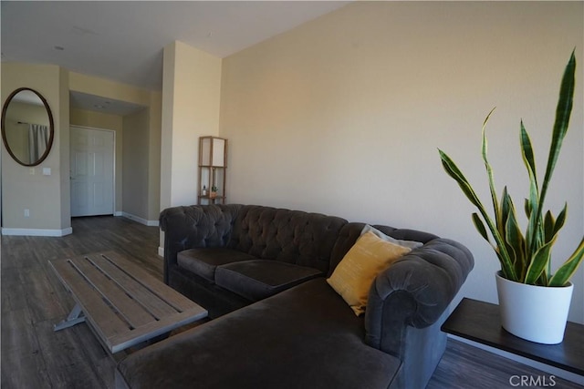 living area with wood finished floors and baseboards