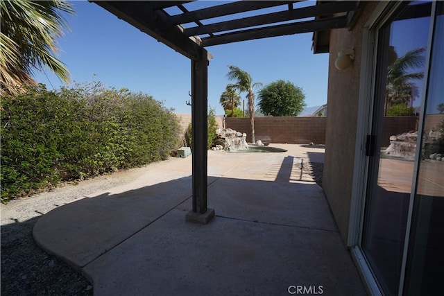 view of patio / terrace featuring a fenced backyard and a pergola