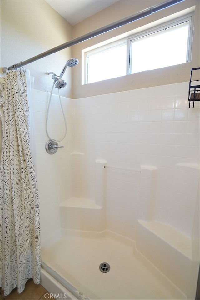 bathroom with a shower stall