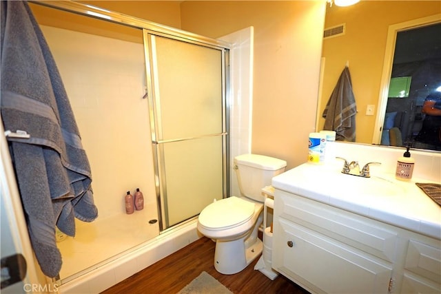 622 E Lomita Ave, Orange, CA 92867 - full bath featuring a shower stall, wood finished floors, vanity, toilet, and visible vents