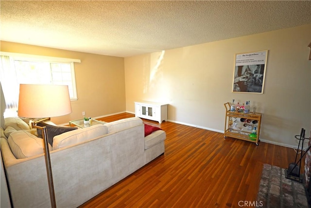622 E Lomita Ave, Orange, CA 92867 - living area with baseboards, wood finished floors, and a textured ceiling