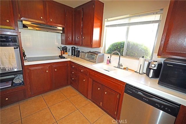 622 E Lomita Ave, Orange, CA 92867 - kitchen with a sink, a warming drawer, light countertops, under cabinet range hood, and black appliances