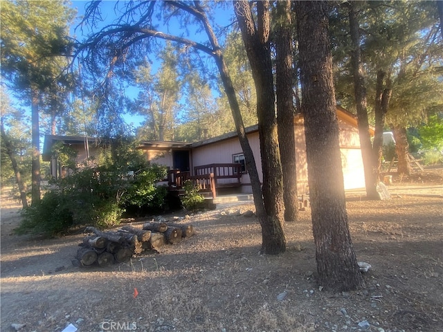 view of front of home featuring a wooden deck