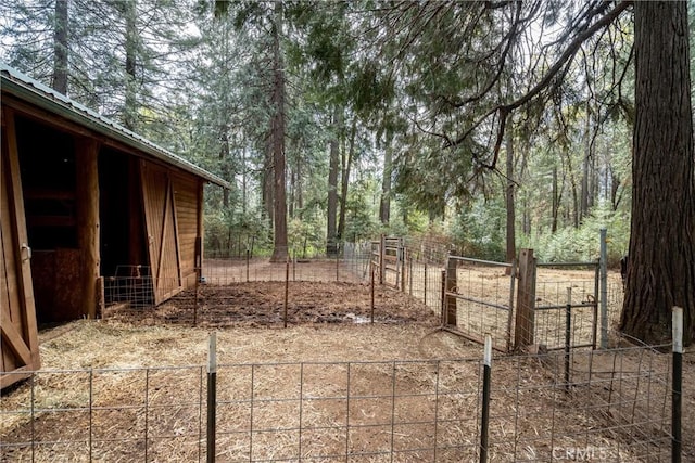 view of yard with an outbuilding and an exterior structure