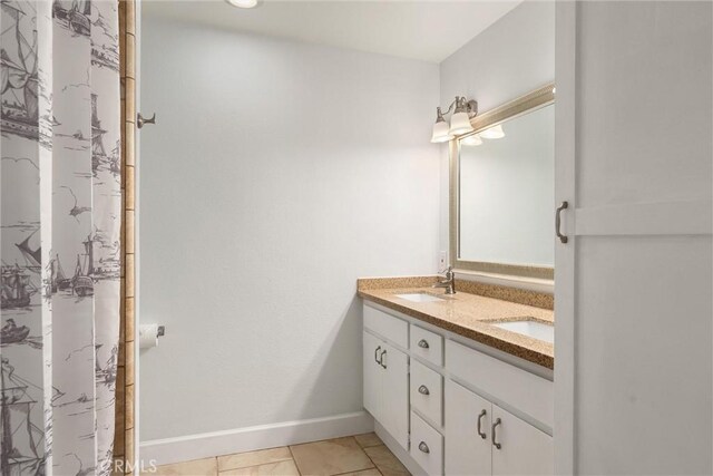 bathroom featuring tile patterned floors and vanity