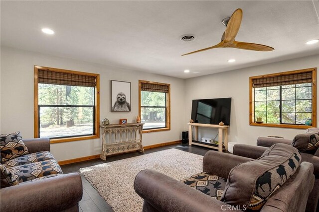 living room with hardwood / wood-style floors and ceiling fan