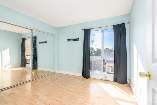 unfurnished room featuring light wood-type flooring