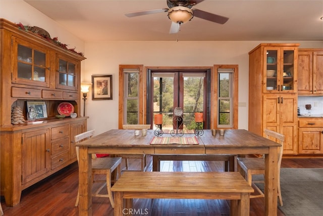 dining space featuring dark hardwood / wood-style flooring and ceiling fan