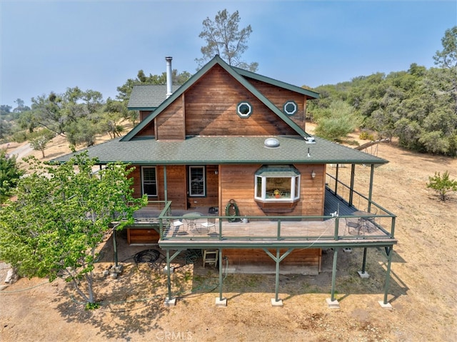 rear view of house with a deck