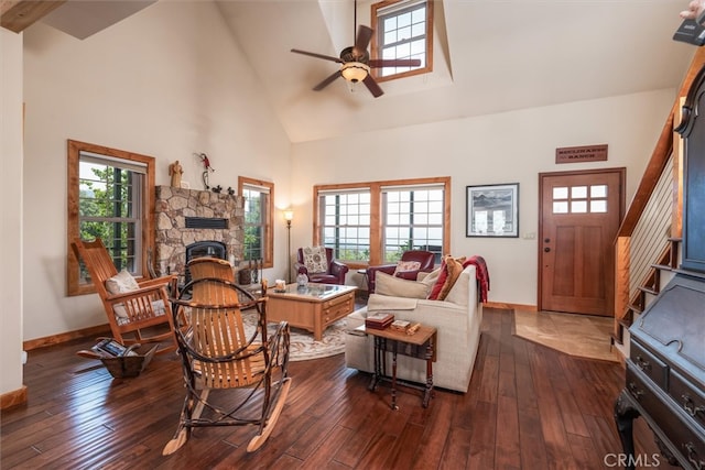 living room with ceiling fan, dark hardwood / wood-style flooring, and high vaulted ceiling