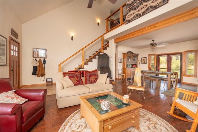 living room with beam ceiling, high vaulted ceiling, dark hardwood / wood-style flooring, ceiling fan, and french doors