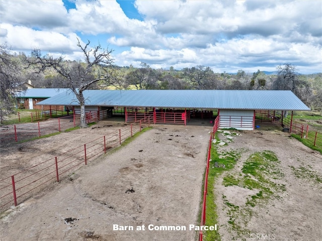 view of front of house with a rural view