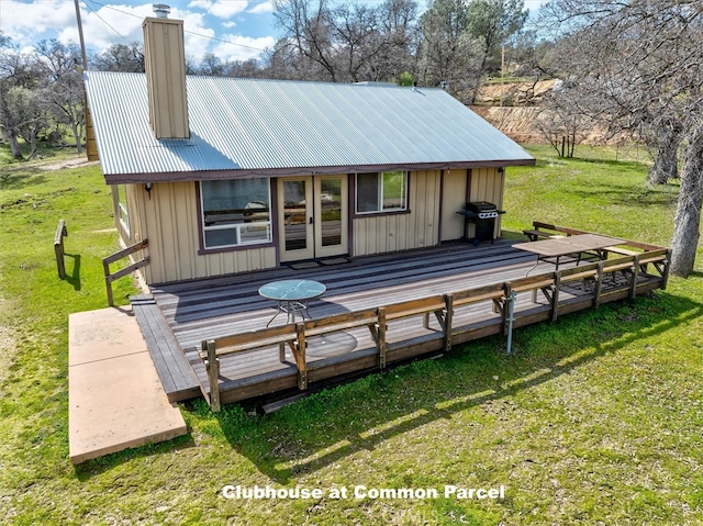 exterior space with a lawn and a wooden deck