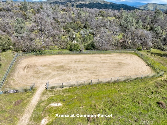 drone / aerial view featuring a mountain view and a rural view