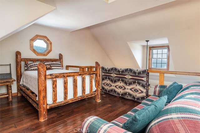 bedroom featuring lofted ceiling and dark wood-type flooring