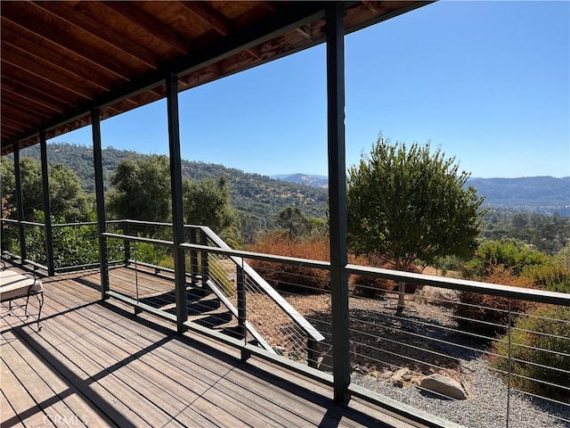 wooden terrace featuring a mountain view