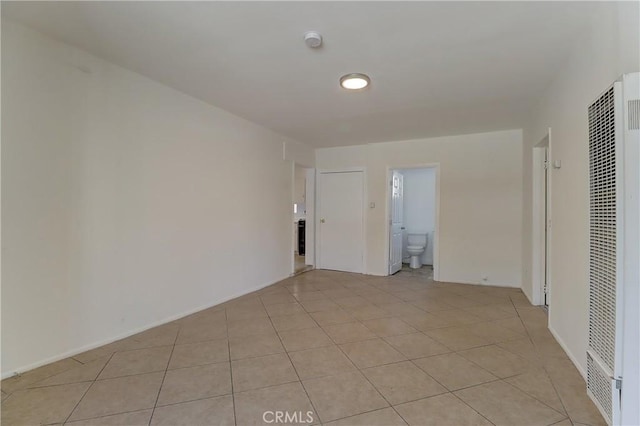 spare room with light tile patterned floors