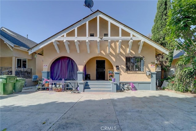 view of front facade with a patio area